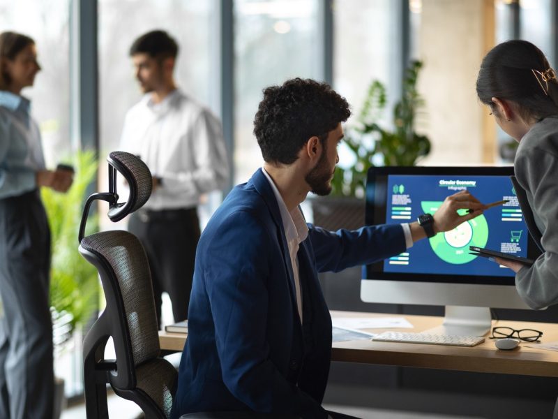 people-office-analyzing-checking-finance-graphs-min